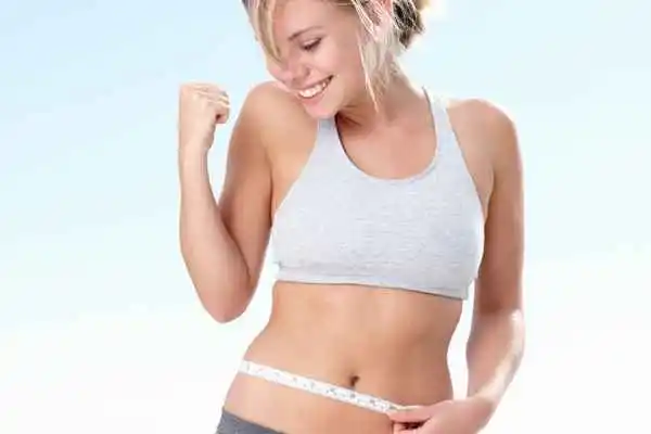 woman happy after fat reduction treatment Holland Park