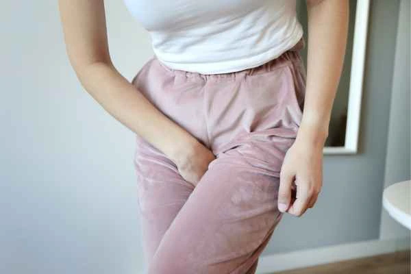 older woman running to the toilet because of urinary incontinence Holland Park