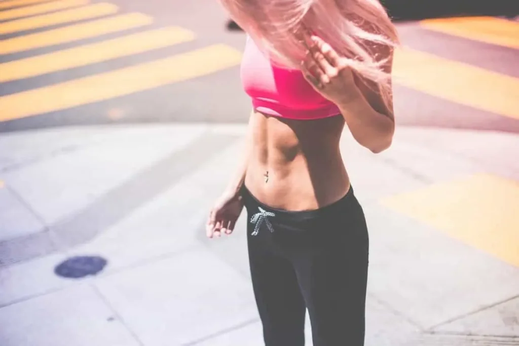 Woman with toned stomach after LA-EMS Body Sculpting Treatment Holland Park